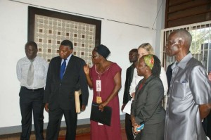 Dr. Kirumira explains an art work to the High Commissioner