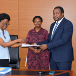 Outgoing Head of Department, Assoc. Prof. Robinah Kulabako (left), hands over the office to the incoming Head of Department, Dr. Philip Nyenje, during a ceremony held at CEDAT on October 5, 2026. In the centre is the Dean, School of Engineering, Assoc. Prof. Eng. Dorothy Okello.