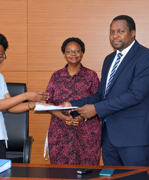 Outgoing Head of Department, Assoc. Prof. Robinah Kulabako (left), hands over the office to the incoming Head of Department, Dr. Philip Nyenje, during a ceremony held at CEDAT on October 5, 2026. In the centre is the Dean, School of Engineering, Assoc. Prof. Eng. Dorothy Okello.