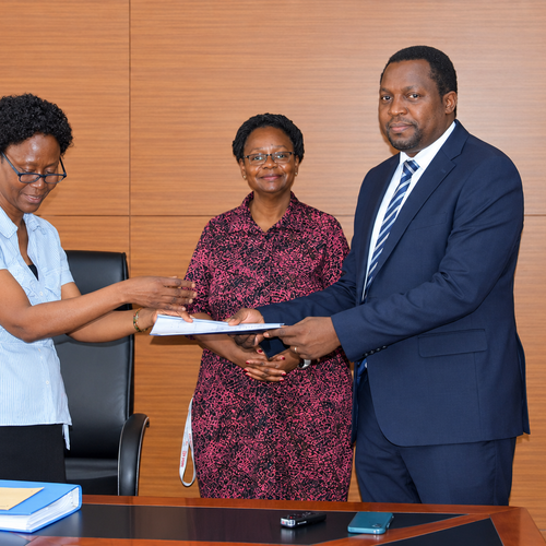 Outgoing Head of Department, Assoc. Prof. Robinah Kulabako (left), hands over the office to the incoming Head of Department, Dr. Philip Nyenje, during a ceremony held at CEDAT on October 5, 2026. In the centre is the Dean, School of Engineering, Assoc. Prof. Eng. Dorothy Okello.